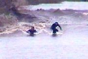 Tomo And Matt Below The SB Pub With A Churning Wall Developing Behind